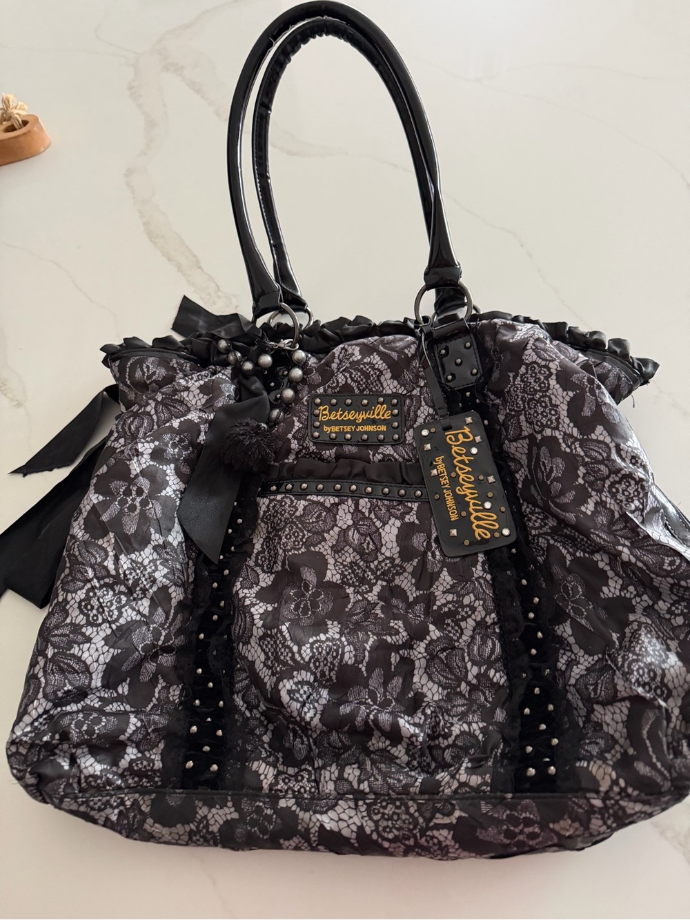 Betsey Johnson Black Lace-Overlay Tote with Stud and Bow Accents